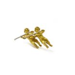 An 18ct yellow gold cherub brooch, in the form of two cherubs playing music, by Marshall Field,