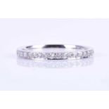 A platinum and diamond eternity ring, pave-set with round brilliant-cut diamonds of approximately