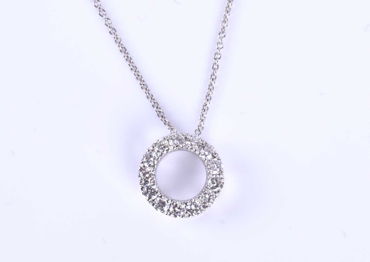 An 18ct white gold and diamond circular pendant, set with round brilliant-cut diamonds, pendant
