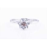 An 18ct white gold and solitaire diamond ring, set with a round brilliant-cut diamond of