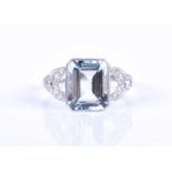 A diamond and aquamarine ring, set with an emerald-cut aquamarine of approximately 3.0 carats, the