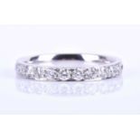 A platinum and diamond eternity ring, inset with round brilliant-cut diamonds of approximately 0.