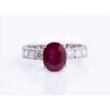 An impressive diamond and ruby ring, the diamond band inset with old-cut diamonds of approximately