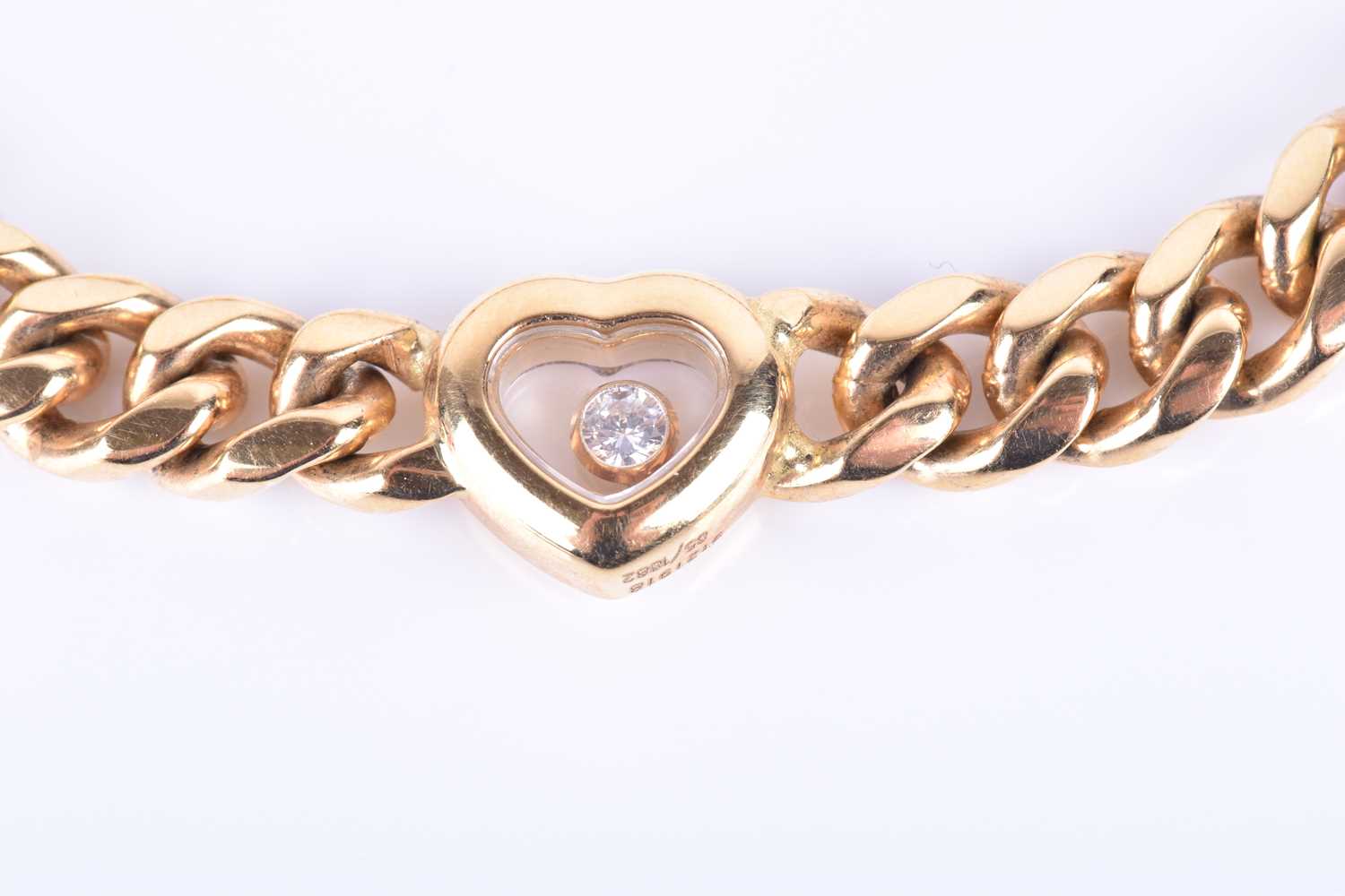 Chopard. An 18ct yellow gold Happy Diamond bracelet, set with a heart-shaped segment inset with a ' - Image 3 of 6