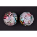 Two mid century Murano glass scramble paperweights, each containing a profusion of polychrome