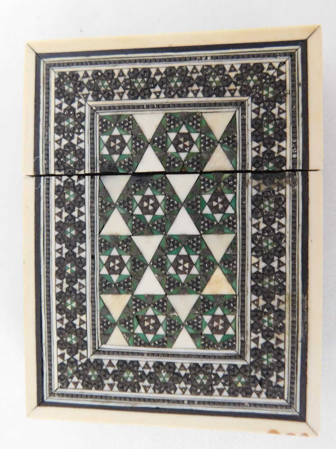 A Victorian sadeli and sandalwood card case, decorated throughout with geometric inlaid pattern