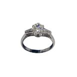 A platinum and diamond solitaire ring, the central old cushion cut diamond of J/K colour and SI1