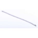 A 14k white gold and diamond line bracelet, set with forty round brilliant-cut diamonds of