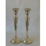 A pair of Geo V silver candlesticks, Marson & Jones, Birmingham 1923, with beaded decoration and