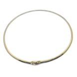 An 18ct gold two colour reversible omega necklet, one side is yellow gold, the other side is white