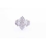 A diamond cluster ring, set with a marquise-shaped cluster set with small round-cut diamonds, within