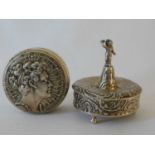 A German silver figural pill box, Simon Rosenau, Hanau c.1895, the lid with applied pedestal