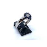 An 18ct white gold, sapphire and diamond ring, the central brilliant cut diamond of I colour and