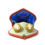 A pair of Victorian yellow metal cameo ear clips, 'grand tour' style souvenir pieces, set with shell