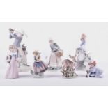 A group of seven Lladro porcelain figures, comprising a a golfer, a girl with flowers, a deer, a
