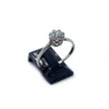 An 18ct white gold single stone diamond ring, set with an old brilliant cut diamonds of