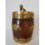 A Chinese barrel form hard wood tea caddy, late 19th/early 20th century, with polished brass shi-shi