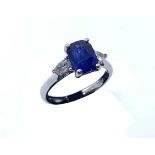 A .950 platinum, sapphire and diamond ring, set with a central certificated octagon step-cut