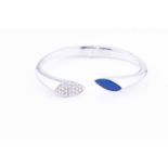 A white metal, diamond and lapis lazuli bracelet, the hinged bangle with one terminal pave set