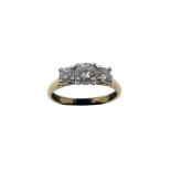 An 18ct yellow gold three stone diamond ring, set with three brilliant cut diamonds of I/J colour