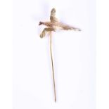 A yellow metal novelty tie-pin, in the form of a flying pheasant, bi-coloured gold, marked 10K, 2.
