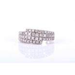 A 9k yellow gold and diamond ring, in the crossover style, set with four rows of round brilliant-cut