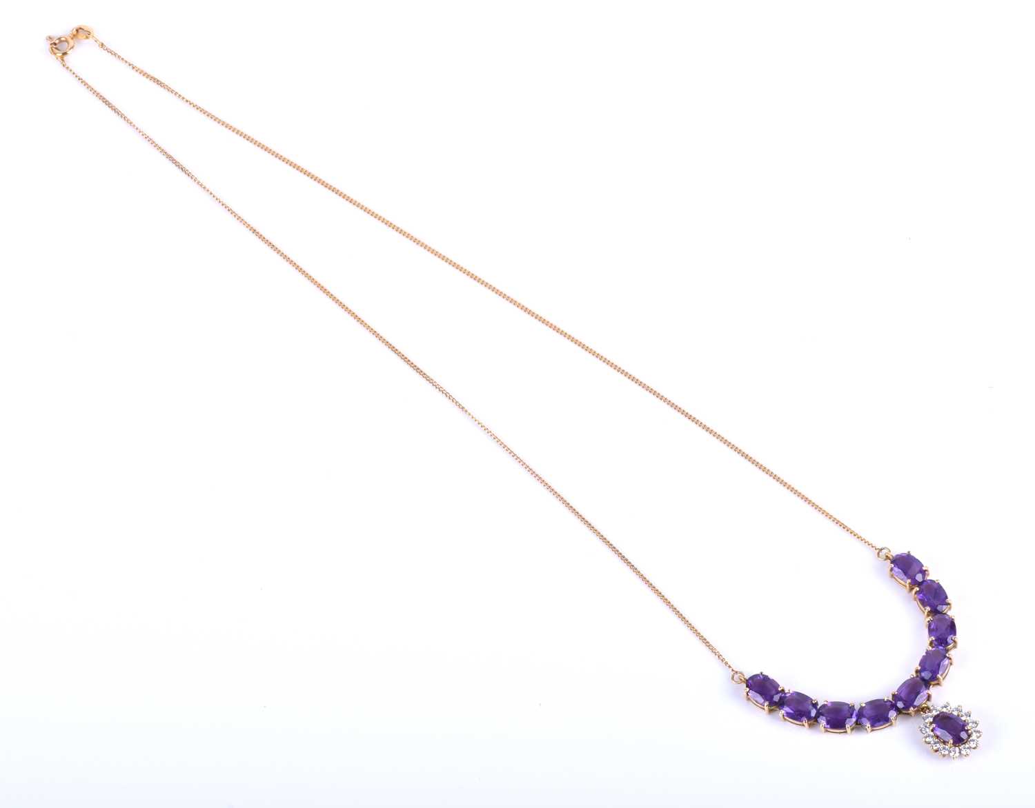 A 14ct yellow gold, amethyst and CZ necklace, set with an articulated line of mixed oval-cut