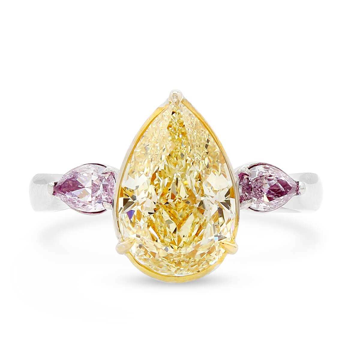 An impressive 18ct gold and fancy-yellow diamond ring, centred with a pear-cut fancy yellow