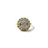 An 18ct yellow gold and diamond cluster ring, set with round-cut diamonds, the shank marked 'Plat