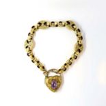 A Victorian yellow metal fancy-link bracelet, possibly 9ct, with engraved locket clasp with