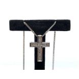 An 18ct white gold and diamond cross, set with 16 channel-set princess cut diamonds of I/J colour