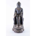A 20th century Chinese carved wood model of Buddha, seated on a stylised double-lotus throne.42 cm