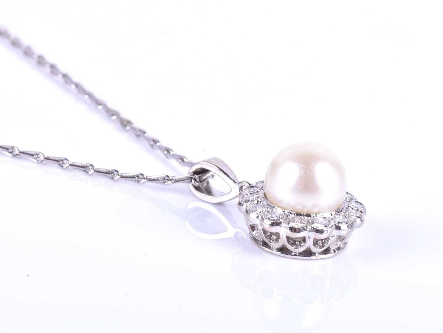 An 18ct white gold, diamond and pearl pendant, the white pearl approximately 7 mm diameter, within a - Image 2 of 5