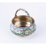 A Russian silver gilt and cloisonné enamel swing-handled sugar bowl, bearing the mark of Vasily