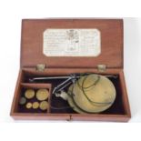 An early 19th century mahogany cased coin scale and weights, with applied label for 'Young & Son,