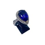 An 18ct yellow gold, platinum, tanzanite and diamond ring, set with a central pearshape AAAA grade