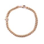 Chopard. An 18ct yellow gold Happy Diamond bracelet, set with a heart-shaped segment inset with a '
