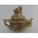 A carved Shoushan stone teapot, Republic period, circa 1920's, the lotus shape lid with dusk finial,
