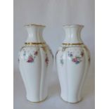 A pair of Royal Crown Derby 'Royal Antoinette' vases, decorated with floral swags beneath a gilded