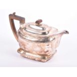 A George III silver teapot and stand, London 1806 by John Emes, with carved wooden handle and