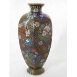 A Japanese cloisonne vase. Late Meiji period, of tapering hexagonal form, decorated with floral mons