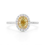 An 18ct gold and yellow diamond ringcentred with a mixed oval-cut fancy yellow diamond of