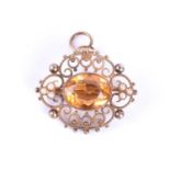 An Edwardian yellow metal, pearl and citrine brooch / pendant, centred with a mixed oval-cut citrine