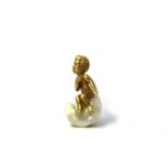 An unusual gold and pearl cherub pin, the Cherub seated on a freshwater pearl cloud, marked 585,