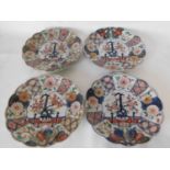A set of four Japanese Imari plates, 18th century, each of chrysanthemum shape, with a central
