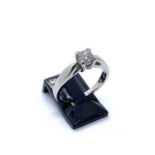 A 14ct white gold single stone diamond ring, set with central claw set princess cut diamond of J