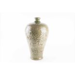 A late Qing dynasty Chinese Meiping vase, designed with raised Longquan style celadon with a