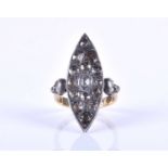 An unusual silver gilt and diamond ring, the marquise-shaped silver mount inset with mixed rose-