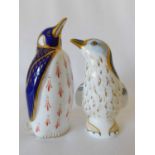 Two Royal Crown Derby Penguin paperweights, the 'Fairy' penguin in blue and gold, the other in Imari