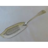 A Georgian silver fiddle pattern fish slice, Thomas Dicks, London 1823, the terminal engraved with a